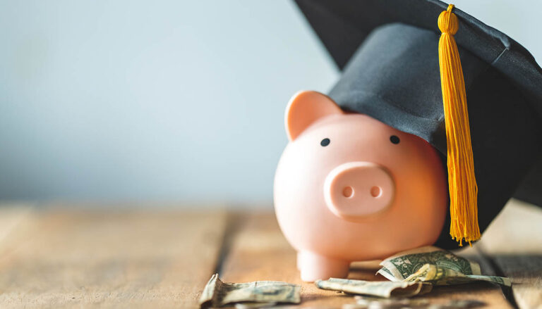 piggy bank With Graduation Cap on old wood,Money saving concept.