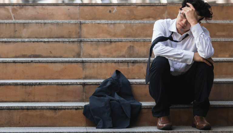 unemployed-man-sitting-on-steps