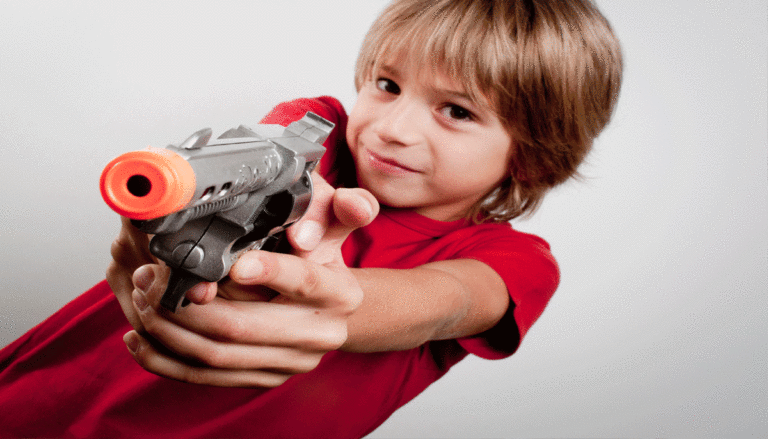 child-holding-toy-gun