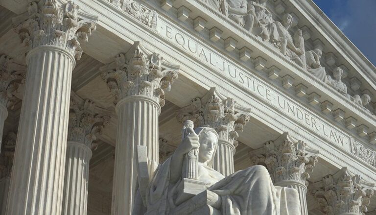 WASHINGTON, DC - OCT 3, 2016: Equal Justice Under Law engraving above entrance to US Supreme Court Building. Supreme Court faces the US Capitol Building.
