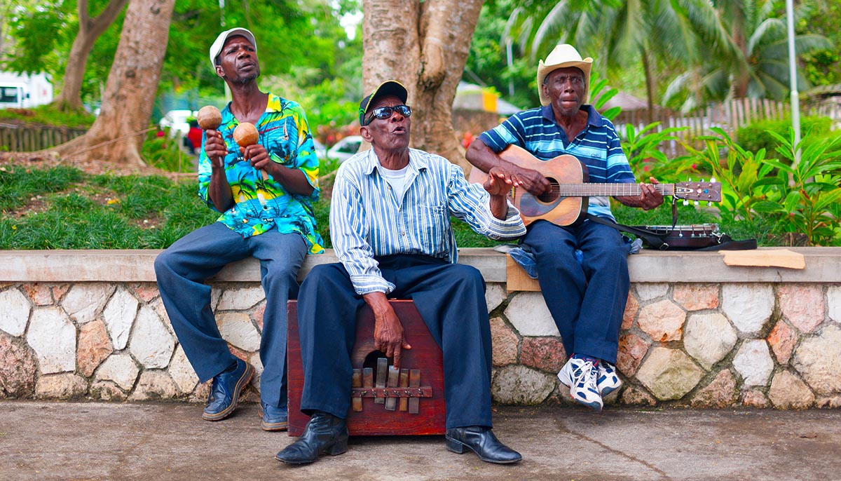 SAINT ANN, NORTH COAST OF JAMAICA - APRIL 2, 2008: A group of local musicians are playing traditional music for tourists.