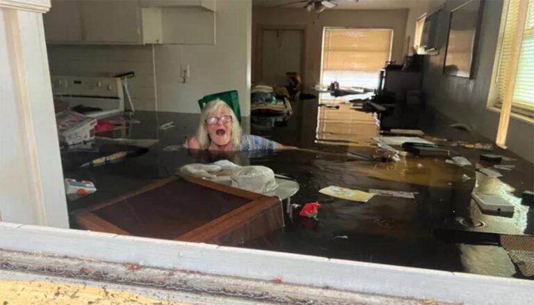 woman in flooded house
