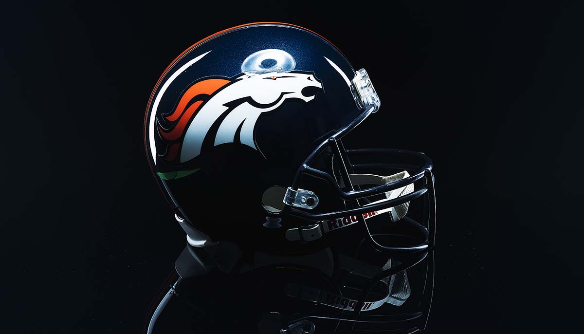 MONTERREY, NL, MEXICO - 04 NOVEMBER 2018 - Denver Broncos NFL club riddell helmet replica on black background, product shot.