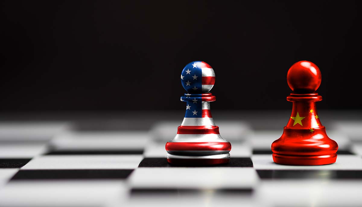 USA flag and China flag print screen on pawn chess with black background.It is symbol of tariff trade war tax barrier between United States of America and China.