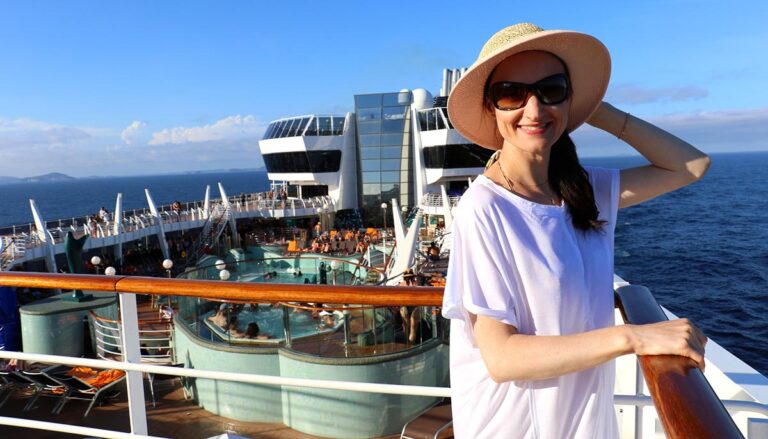 Woman on the top deck of a cruise ship